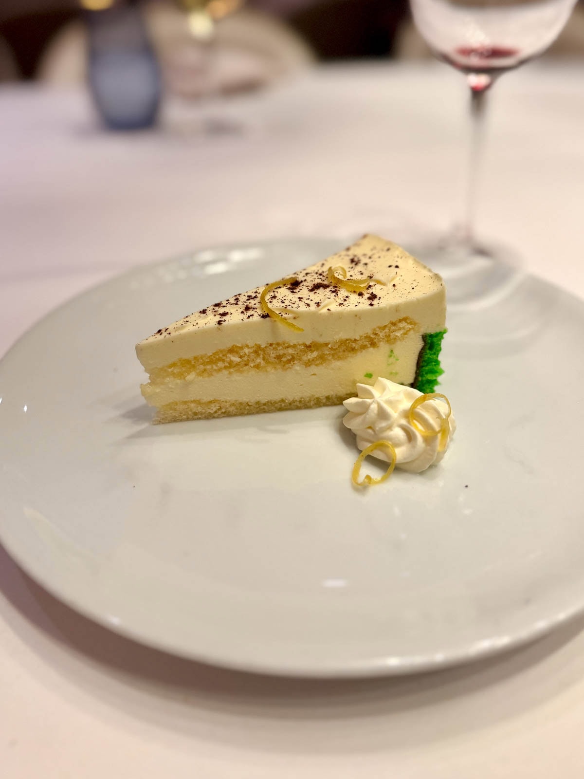 Lemon torte dessert on white plate.