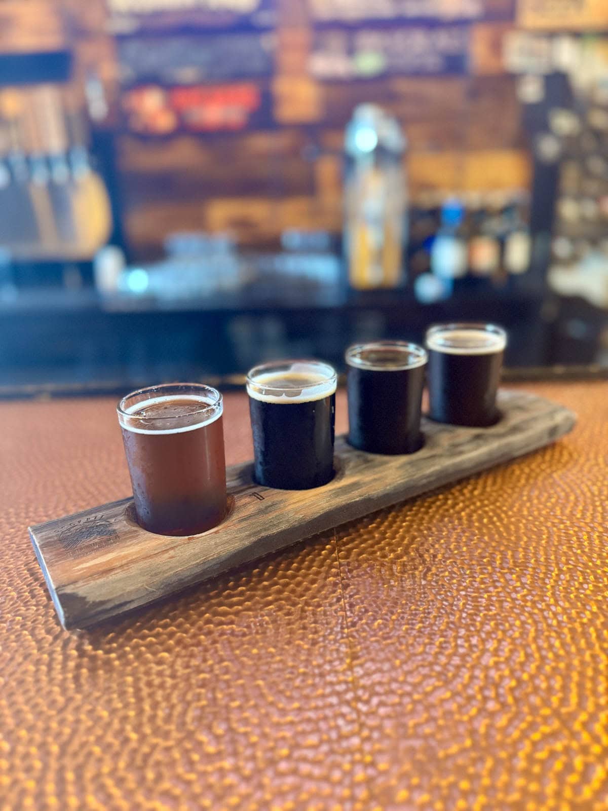 Beer flight on a bar.