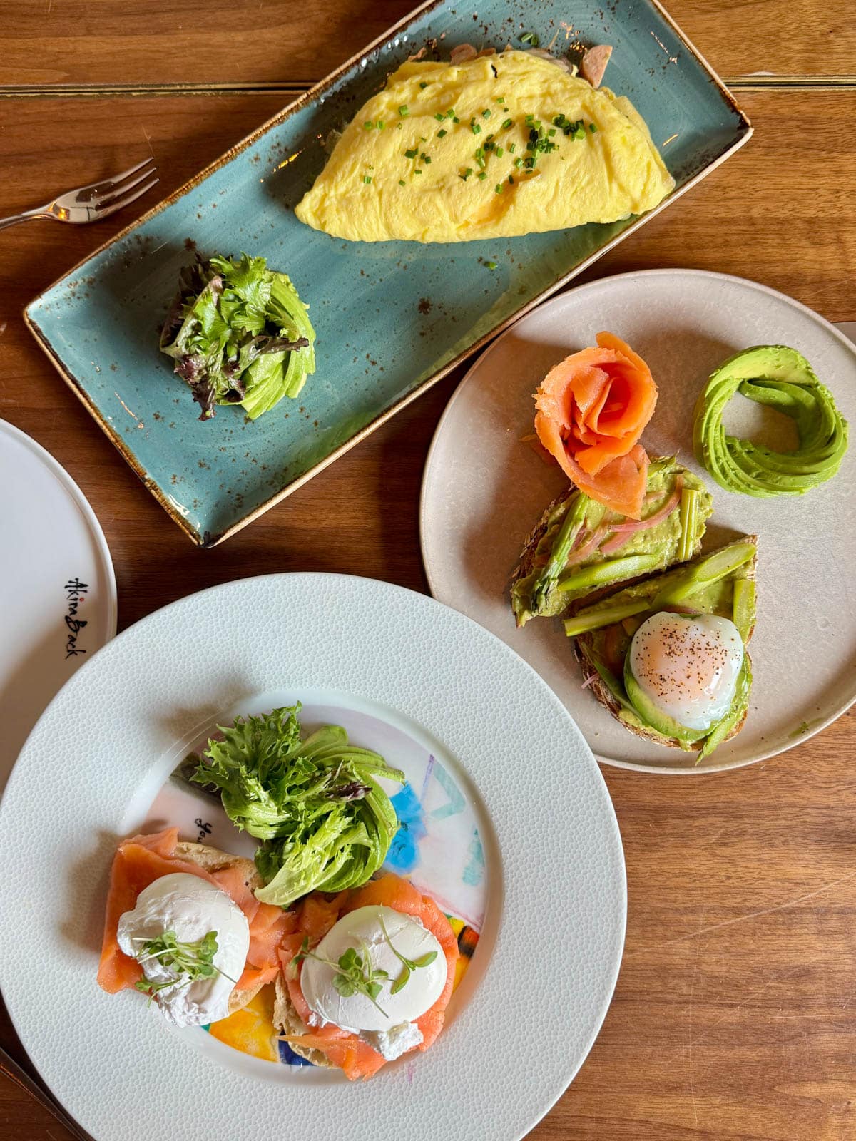 Breakfast dishes on a wood table.