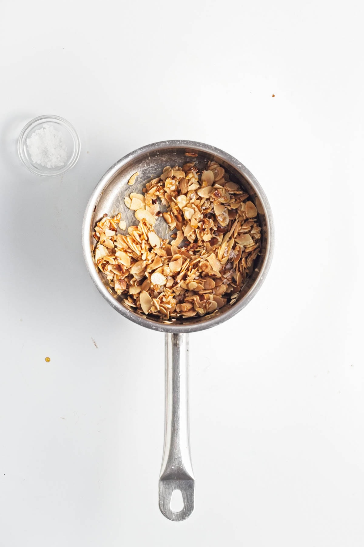Candied almonds in an alunimum pan.