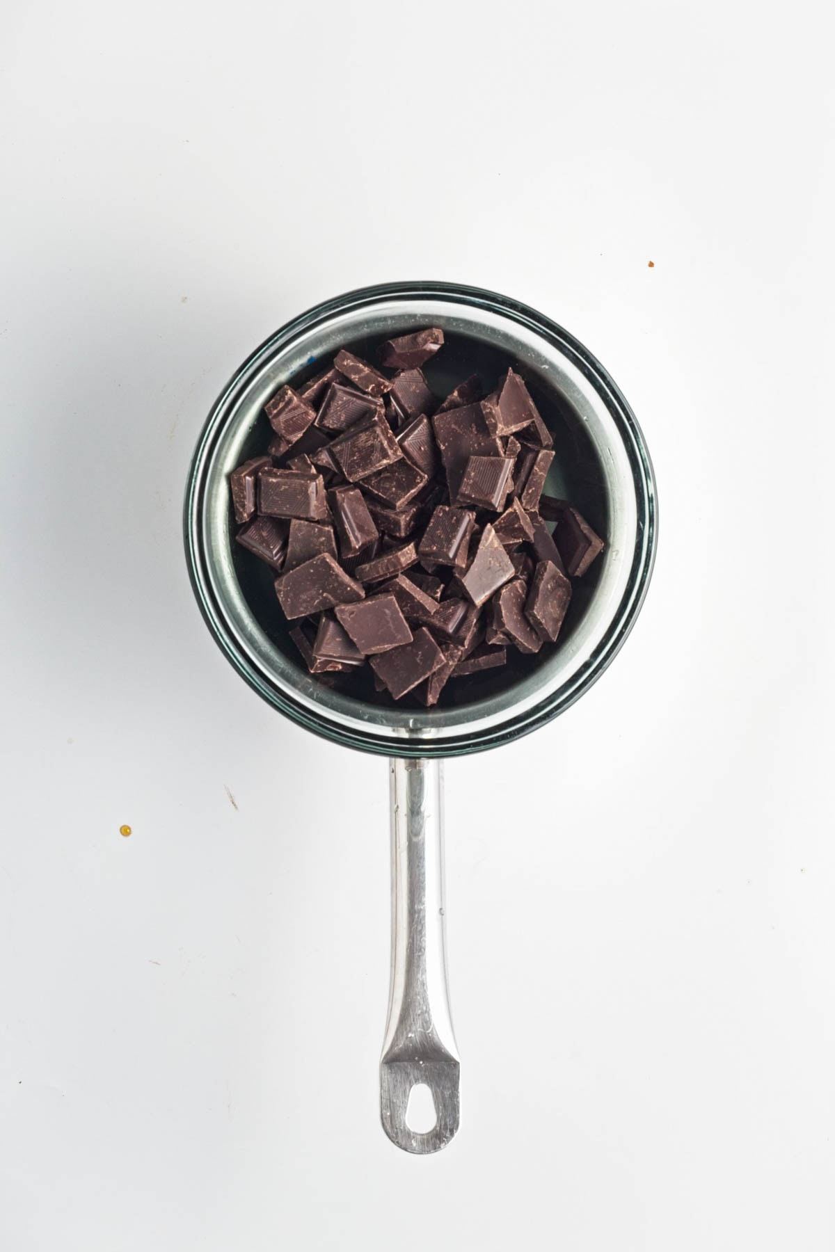 Chocolate squares in an aluminum pan.