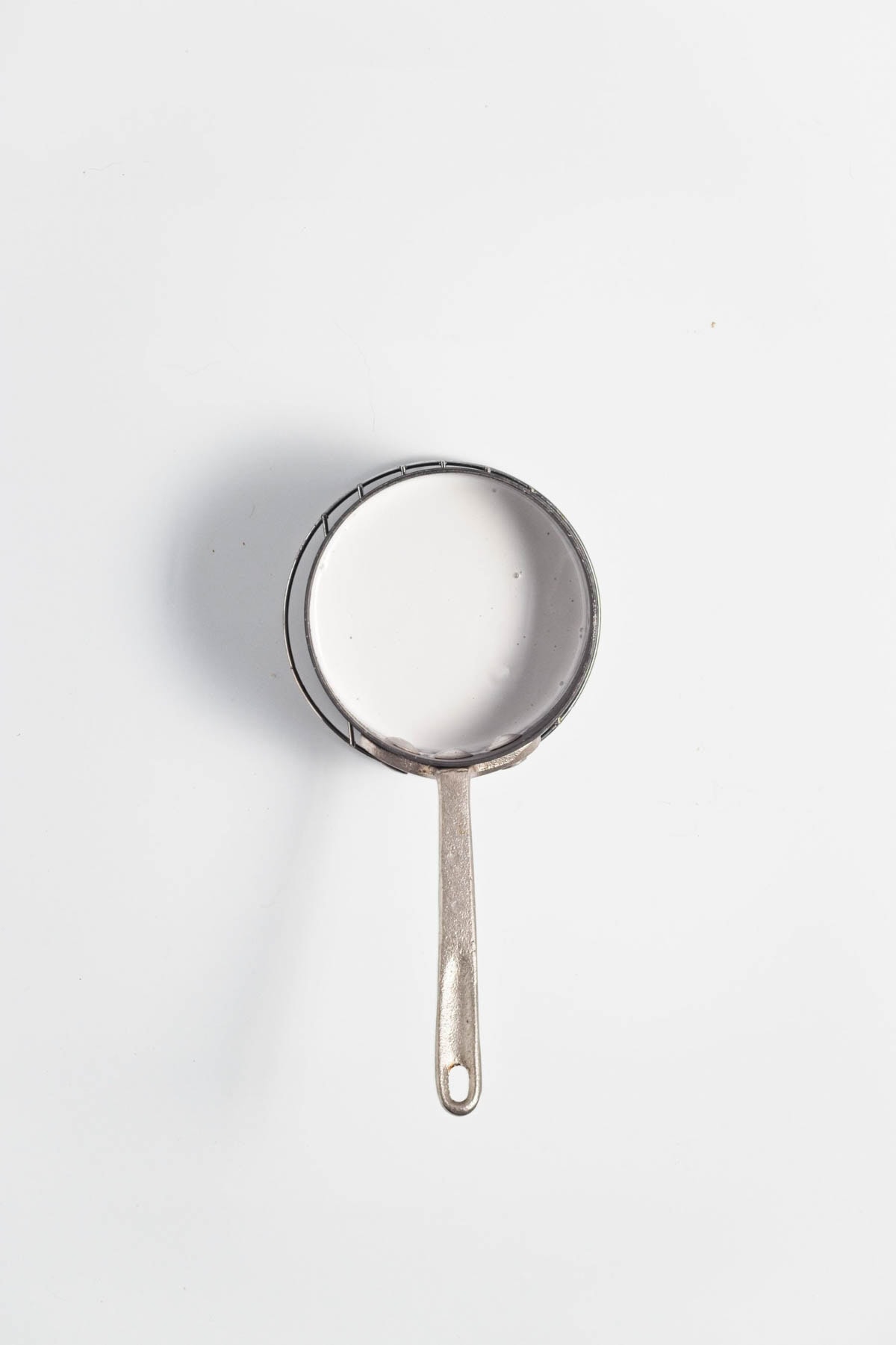 Coconut cream in a small saucepan.