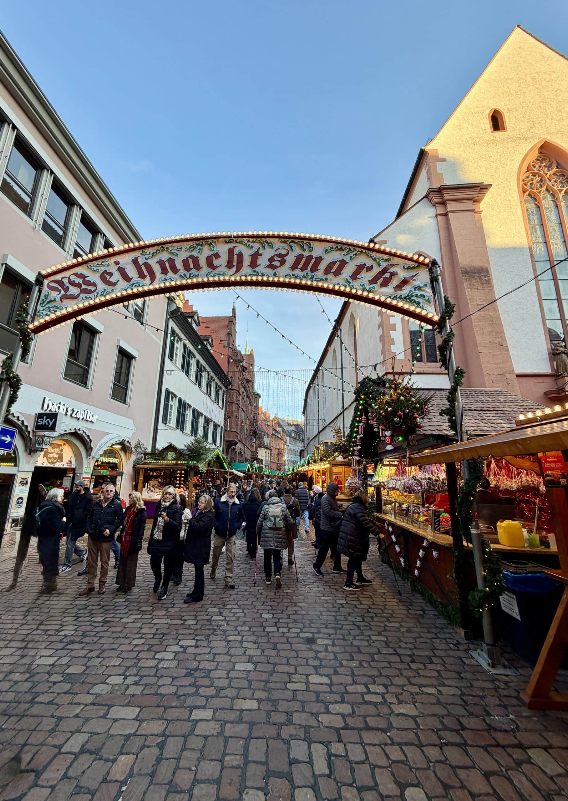 People walking around at a Christmas market.