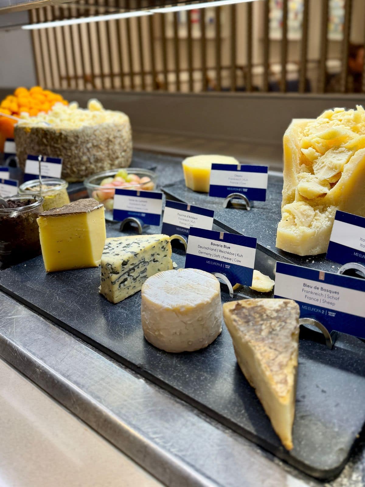 Cheeses and sauces on a buffet.