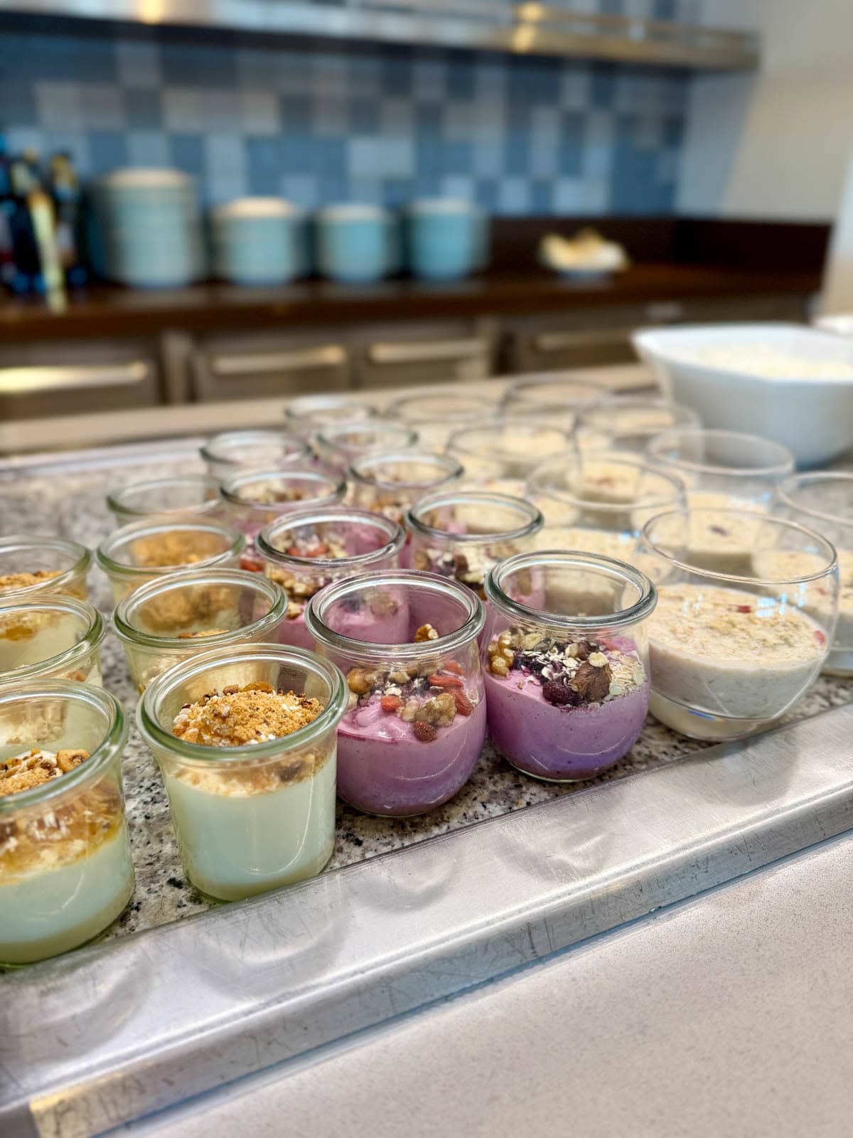 Yogurt parfaits on a breakfast bar.