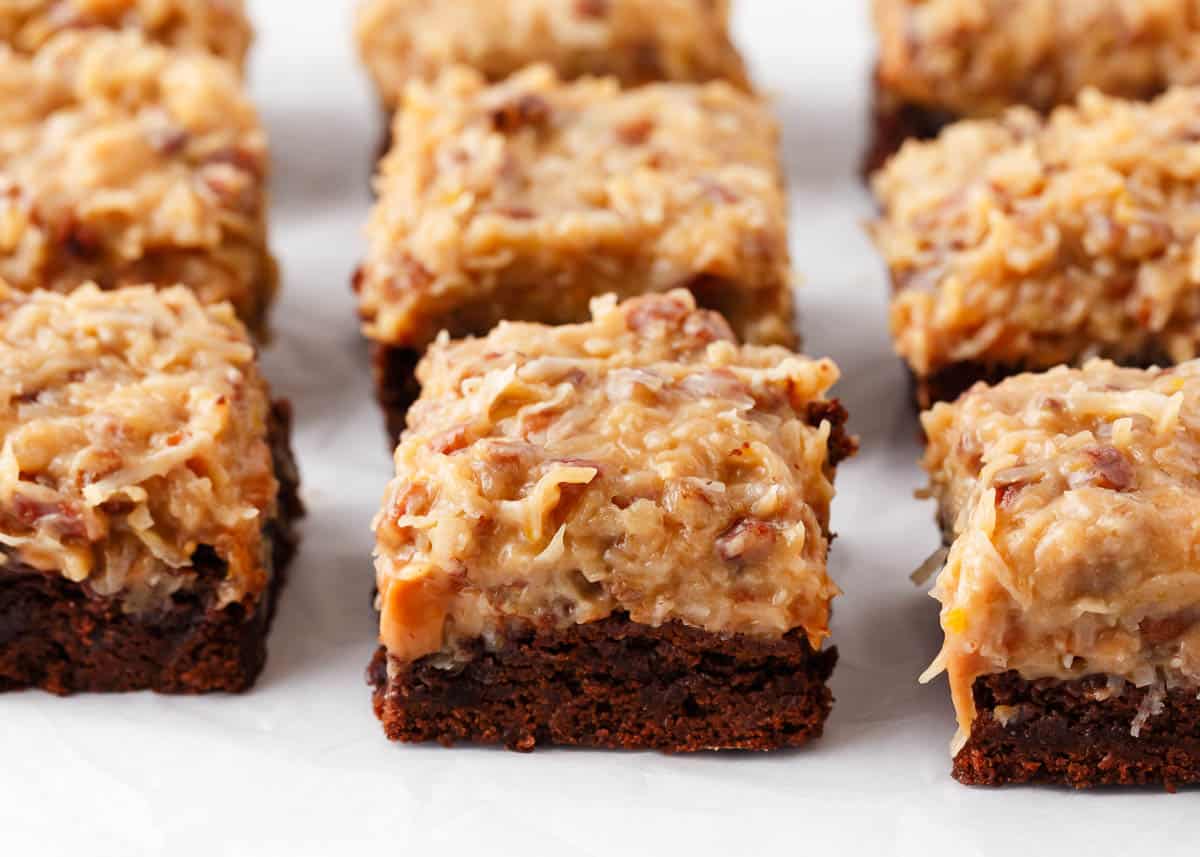 Brownie squares with coconut brown sugar frosting.