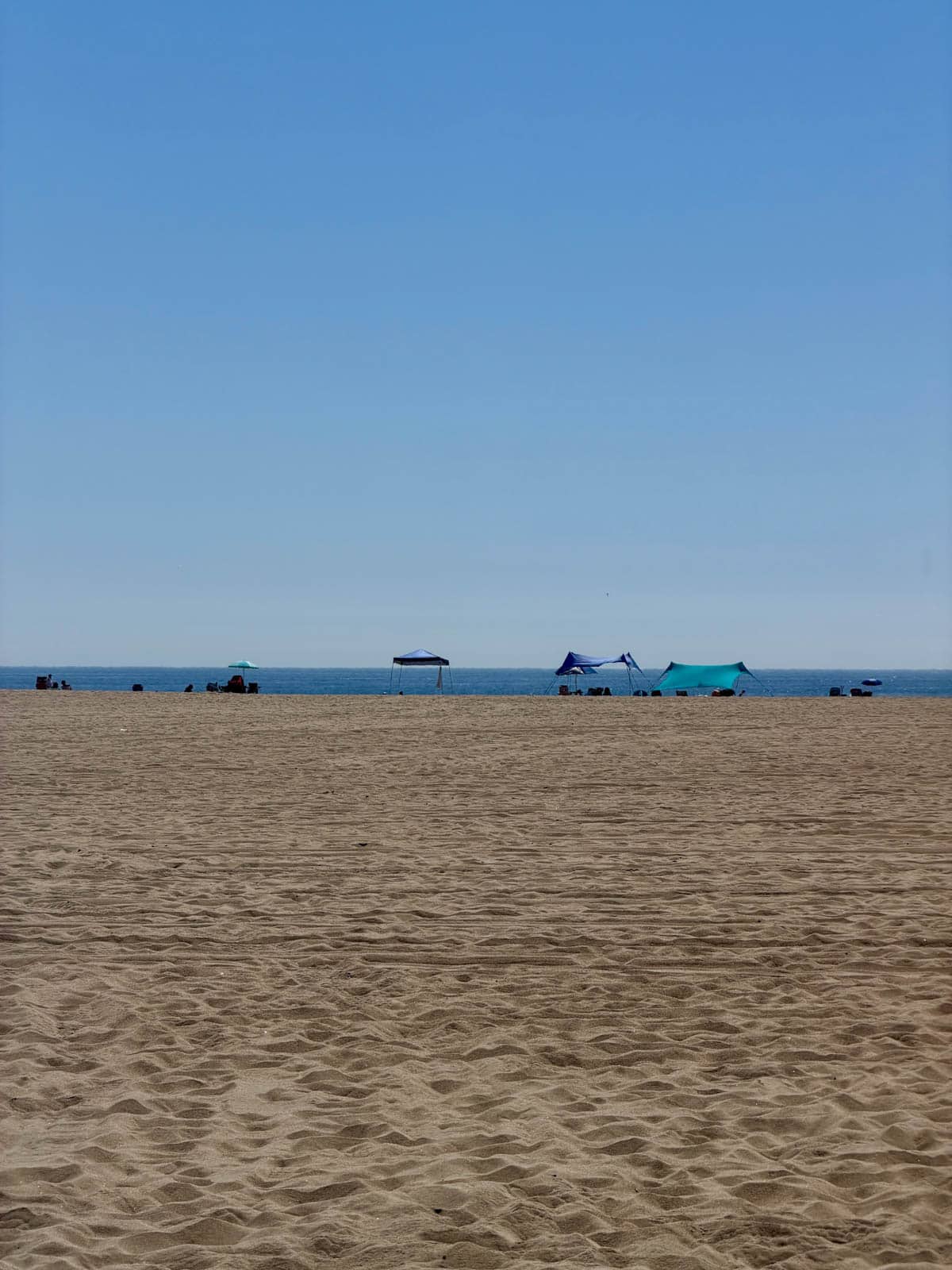 Tents set up on beach.
