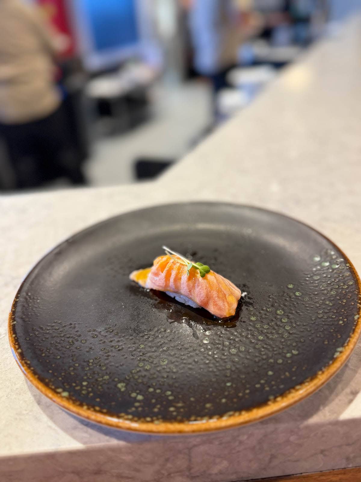 Seared fish with housemade sauce and fresh garnish.