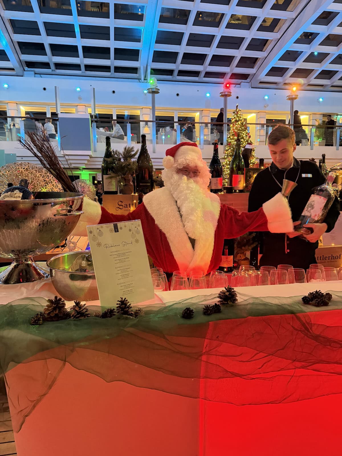 Santa Claus making cocktails at a party.