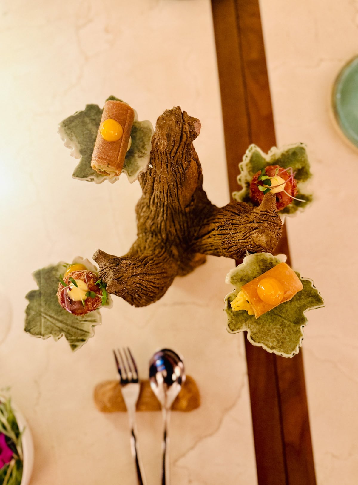 Small hors d'oeuvres served on tree stand.